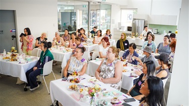 Attendees networking at the International Women's Day high tea event at Fairfield City HQ