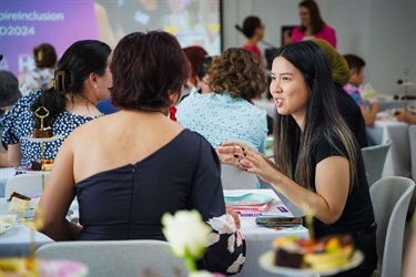 Attendees networking at the International Women's Day high tea event at Fairfield City HQ