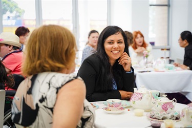 Attendees networking at the International Women's Day high tea event at Fairfield City HQ