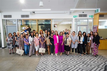 Group photo of attendees at the International Women's Day event held at Fairfield City HQ