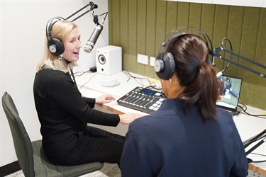 Visitors happily using equipment in recording studio during Fairfield City HQ launch