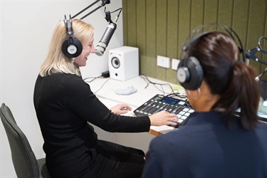 Visitors using equipment in recording studio during Fairfield City HQ launch