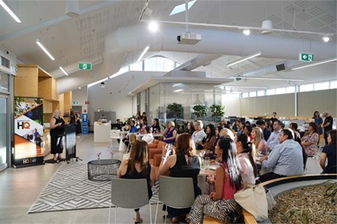 Photo of audience listening to speaker Lee de Winton at the International Women's Day event held at Fairfield City HQ