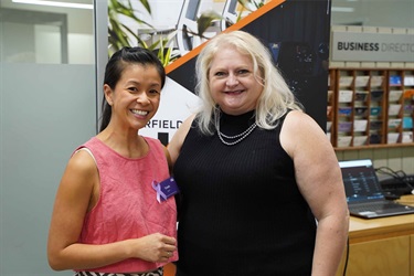 Speaker Lee de Winton with attendee at International Women's Day event held at Fairfield City HQ