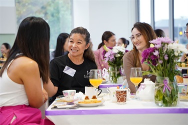 Attendees chat with Jenny Dinh during International Womens Day High Tea in Fairfield City HQ