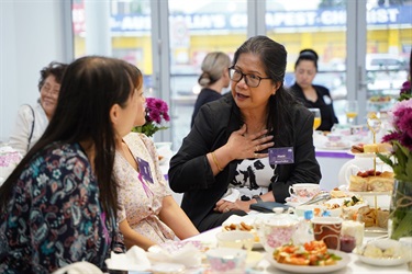 Guests chat during International Womens Day High Tea in Fairfield City HQ