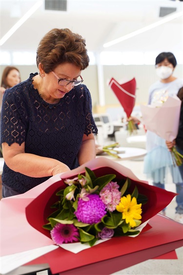 Trainer Lucy from Angkor Flowers and Crafts demonstrating how to wrap a bouquet