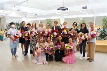 Group photo of attendees at the International Women's Day event held at Fairfield City HQ