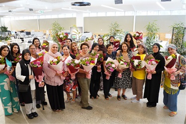 Group photo of attendees at the International Women's Day event held at Fairfield City HQ