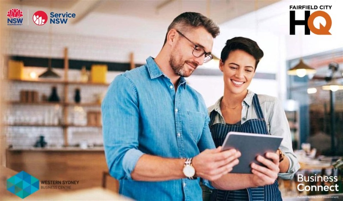 Two people smiling at a tablet, Business Health Check at Fairfield City HQ, 3 & 10 October 2023, 10am to 2pm