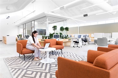 Woman-on-laptop-sitting-on-couch-in-Fairfield-City-HQ.png